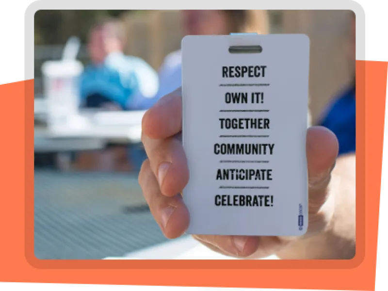 A picture of a badge that says: Respect. Own it! Together. Community. Anticipate. Celebrate! The values of Benefitfocus, Inc. 